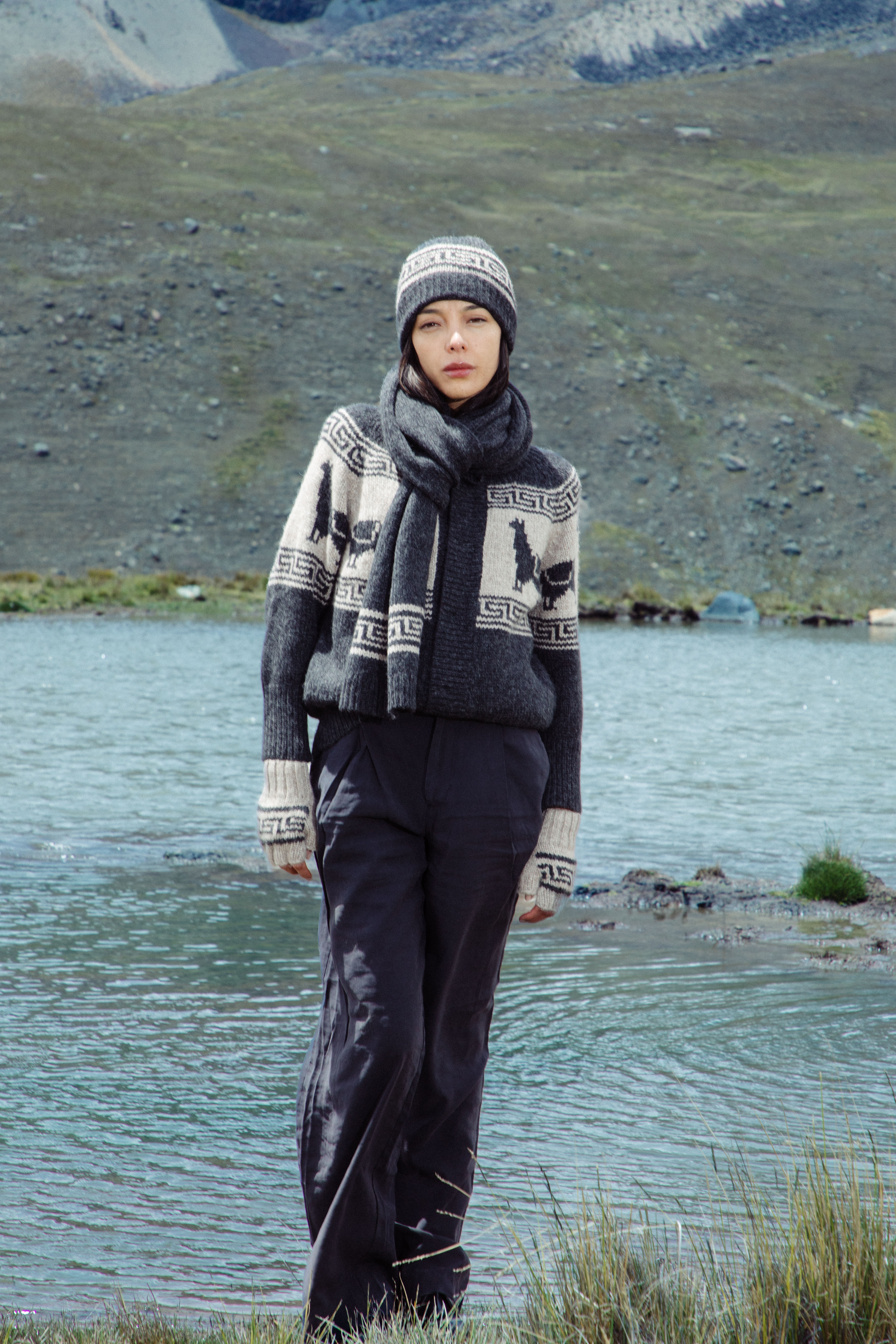Model wearing a natural cream alpaca sweater